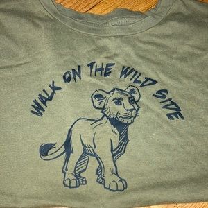 A shirt with a design on simba from the lion king on it